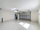Spacious two-car garage featuring epoxy flooring at 1008 Jackson St, The Villages, FL 32162