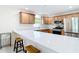 Modern kitchen featuring quartz countertops, stainless steel appliances and wooden cabinets at 1008 Jackson St, The Villages, FL 32162