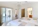 Bright bedroom with tile flooring and a sliding glass door to the lanai at 1008 Jackson St, The Villages, FL 32162
