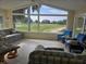 Bright sun room with view of golf course at 1008 Jackson St, The Villages, FL 32162