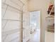 Large walk-in closet adjacent to the main bedroom with extensive shelving at 1008 Jackson St, The Villages, FL 32162
