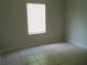 Bright bedroom filled with natural light from the window and features neutral colors at 1021 Golfside Ct, Kissimmee, FL 34741