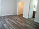 Bedroom featuring hard wood floors, a walk in closet, and a bathroom at 1021 Golfside Ct, Kissimmee, FL 34741