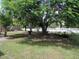Shady front yard showcasing green foliage at 1021 Golfside Ct, Kissimmee, FL 34741