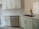 Renovated kitchen featuring stainless steel appliances and stone countertops at 1021 Golfside Ct, Kissimmee, FL 34741