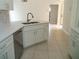 Modern kitchen featuring stainless steel appliances and stone countertops at 1021 Golfside Ct, Kissimmee, FL 34741