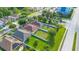 An aerial perspective highlights the home's lawn and nearby community at 10580 Moss Rose Way, Orlando, FL 32832