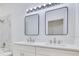Modern bathroom featuring a double vanity, updated lighting, and new sinks and fixtures at 10580 Moss Rose Way, Orlando, FL 32832
