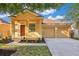 Charming single-story home featuring a two-car garage and well-manicured front yard at 10580 Moss Rose Way, Orlando, FL 32832
