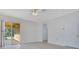 Bright open space featuring sliding glass doors to the outdoors and neutral walls at 10580 Moss Rose Way, Orlando, FL 32832