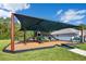 Shaded community playground with slides and climbing equipment, perfect for Gathering fun at 10580 Moss Rose Way, Orlando, FL 32832