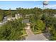 Aerial view of the house surrounded by lush greenery and mature trees showcasing curb appeal at 1130 Burland Cir, Winter Garden, FL 34787