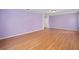 Bright bedroom showcasing wood floors, neutral paint, and plenty of space at 1130 Burland Cir, Winter Garden, FL 34787