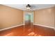 A bedroom featuring hardwood floors, neutral walls, and a ceiling fan at 1130 Burland Cir, Winter Garden, FL 34787