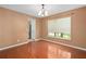 Dining room with hardwood floors, large window, and neutral paint at 1130 Burland Cir, Winter Garden, FL 34787