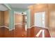 The foyer offers hardwood floors and views into the living and dining areas at 1130 Burland Cir, Winter Garden, FL 34787