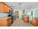Updated kitchen featuring stainless appliances, wood cabinetry and a breakfast bar at 1130 Burland Cir, Winter Garden, FL 34787