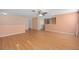 Open living area featuring hardwood floors, neutral paint, and a ceiling fan at 1130 Burland Cir, Winter Garden, FL 34787