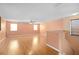 Bright living room with hardwood floors, natural light, and a ceiling fan at 1130 Burland Cir, Winter Garden, FL 34787