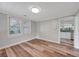 Bedroom featuring wood-look floors and a view into the kitchen at 1310 Coletta Dr, Orlando, FL 32807