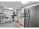 Modern kitchen with stainless steel appliances, granite countertops, and white cabinetry at 1310 Coletta Dr, Orlando, FL 32807