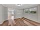 Bright living room featuring wood floors and access to connecting rooms at 1310 Coletta Dr, Orlando, FL 32807