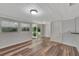 Bright living room featuring wood floors, sliding glass doors, and ample natural light at 1310 Coletta Dr, Orlando, FL 32807