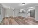 Open living area flows into a kitchen with stainless steel appliances and bar seating at 1310 Coletta Dr, Orlando, FL 32807