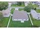 Aerial view of a home with a well-manicured lawn, a fenced yard, and a functional layout at 1373 Burnley Ct, Kissimmee, FL 34758