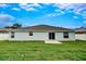 Expansive backyard featuring lush green lawn, a patio, and a privacy fence for secure outdoor activities at 1373 Burnley Ct, Kissimmee, FL 34758