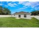 Large backyard with well-maintained lawn, privacy fence, and patio is great for outdoor entertaining at 1373 Burnley Ct, Kissimmee, FL 34758