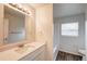 Well-lit bathroom featuring a vanity, sink, mirror, and a shower-tub combo for convenience at 1373 Burnley Ct, Kissimmee, FL 34758