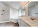 Bathroom with double vanity, shower and tub with marble tile at 1373 Burnley Ct, Kissimmee, FL 34758