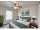 Comfortable bedroom featuring modern decor, a ceiling fan, and bright light at 1373 Burnley Ct, Kissimmee, FL 34758
