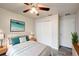 This bedroom features wood-look floors, a ceiling fan, and closet space at 1373 Burnley Ct, Kissimmee, FL 34758
