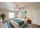 Inviting bedroom with ample natural light, stylish décor, and wood-look floors at 1373 Burnley Ct, Kissimmee, FL 34758