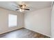An empty bedroom with wooden floors and a ceiling fan at 1373 Burnley Ct, Kissimmee, FL 34758