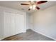 This bedroom features hardwood floors and a closet at 1373 Burnley Ct, Kissimmee, FL 34758