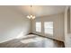 Bright dining area featuring stylish chandelier and window views at 1373 Burnley Ct, Kissimmee, FL 34758
