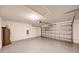 Spacious garage with ample room, a garage door, and functional lighting for parking and storage at 1373 Burnley Ct, Kissimmee, FL 34758