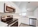 This is a close up of the kitchen features stainless steel appliances and white cabinets at 1373 Burnley Ct, Kissimmee, FL 34758