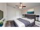 Comfortable main bedroom featuring a ceiling fan, stylish decor, and hardwood floors at 1373 Burnley Ct, Kissimmee, FL 34758