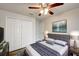 Well-lit main bedroom with ceiling fan, closet and decorative painting at 1373 Burnley Ct, Kissimmee, FL 34758