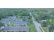 An aerial view of quaint single-story condo community, surrounded by lush, mature trees and landscaping at 141 N Hill Ave # 141, Deland, FL 32724