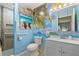 Bright bathroom featuring stylish beach themed decor, grab bars, and modern fixtures at 141 N Hill Ave # 141, Deland, FL 32724