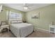 Cozy bedroom with soft green walls, neutral carpet, and a peaceful ambiance at 141 N Hill Ave # 141, Deland, FL 32724