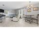 Bright living room area combining living, dining and foyer, with accent wall and an open layout at 141 N Hill Ave # 141, Deland, FL 32724