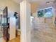 Updated bathroom features stylish tile shower, window, niche, and unique door hardware at 14529 Falling Tree Ct, Orlando, FL 32837