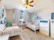 Cozy bedroom featuring twin beds, bright window with natural light, and ample storage with dressers at 14529 Falling Tree Ct, Orlando, FL 32837