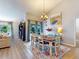 Inviting dining room featuring a wood table, colorful rug, and access to the backyard, perfect for gatherings at 14529 Falling Tree Ct, Orlando, FL 32837